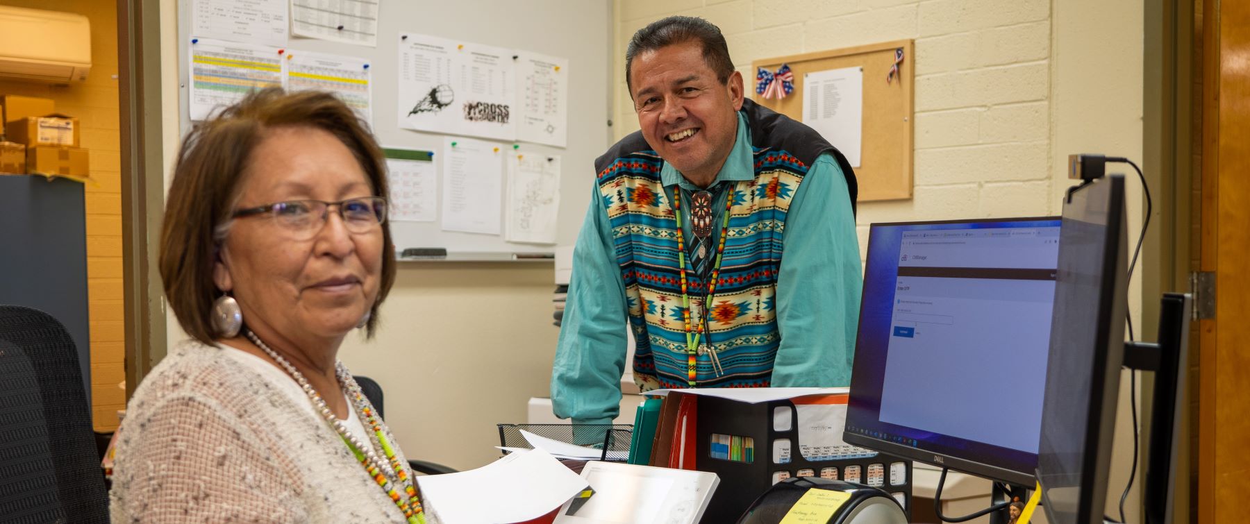 two staff members in the school office